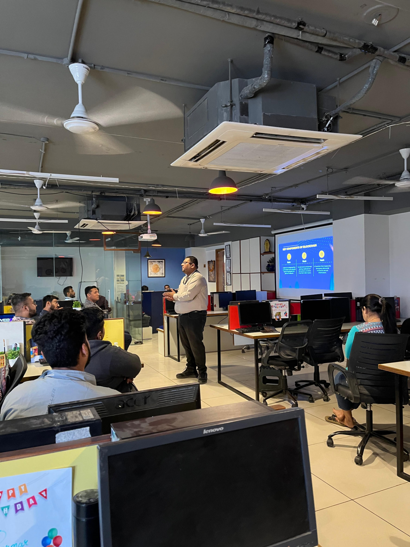 Speaker presenting key components of blockchain